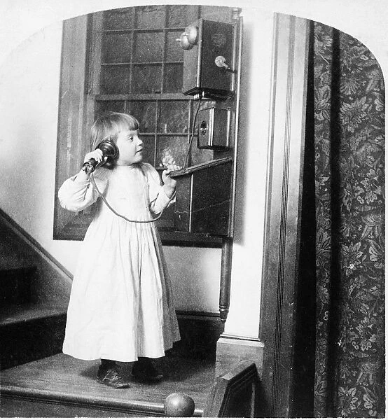 CHRISTMAS, c1892. A girl speaking to Santa Claus on a telephone on Christmas. Stereograph
