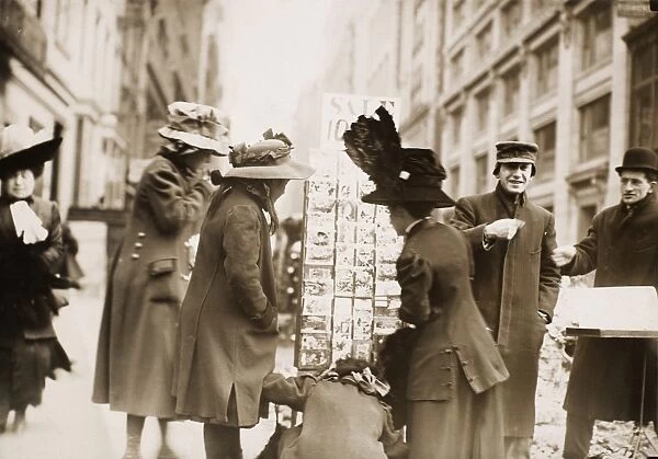 CHRISTMAS POSTCARDS, c1900. Shopping for Christmas postcards in New York City, c1900