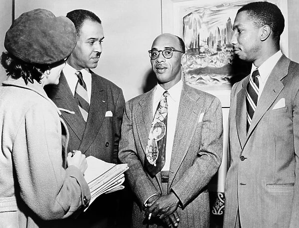 CIVIL RIGHTS ACTIVISTS. American civil rights activists Heman Sweatt (center) with Roy Wilkins