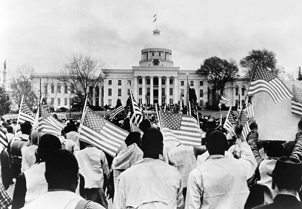 CIVIL RIGHTS MARCH, 1965. A group of protesters with American flags in front of