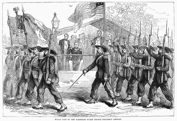 CIVIL WAR: 39th REGIMENT. The 39th New York State Volunteers, known as the Garibaldi Guard, carrying the Italian revolutionary tricolor flag, marching past President Lincoln during the Civil War, c1862. Wood engraving, late 19th century