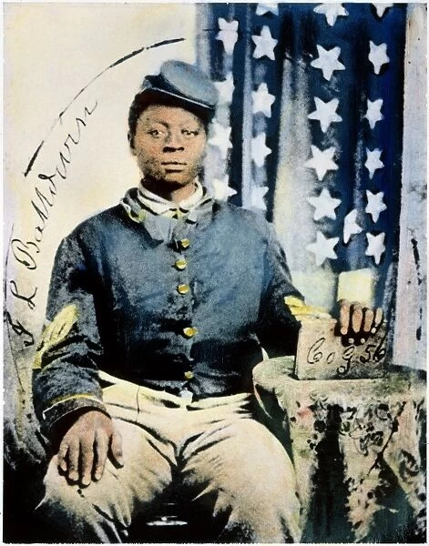 CIVIL WAR: BLACK SOLDIER. Studio portrait of Sgt. J. L. Baldwin of Company G, 56th U. S. Colored Infantry, organized in August 1863. Oil over a photograph