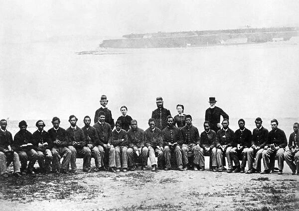 CIVIL WAR: BLACK TROOPS. Black soldiers with Northern teachers, probably on the South Carolina coast, c1863-65