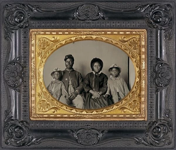 CIVIL WAR: FAMILY, c1864. Portrait of a Union soldier with his wife and daughters