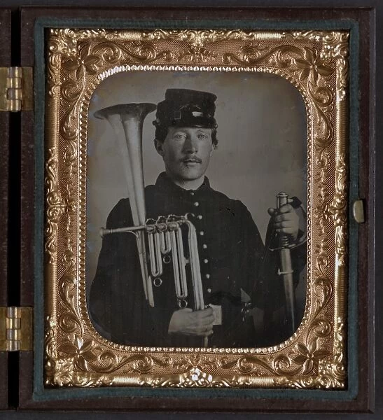 CIVIL WAR: MUSICIAN, c1863. Portrait of a Union soldier holding a saxhorn and a sword