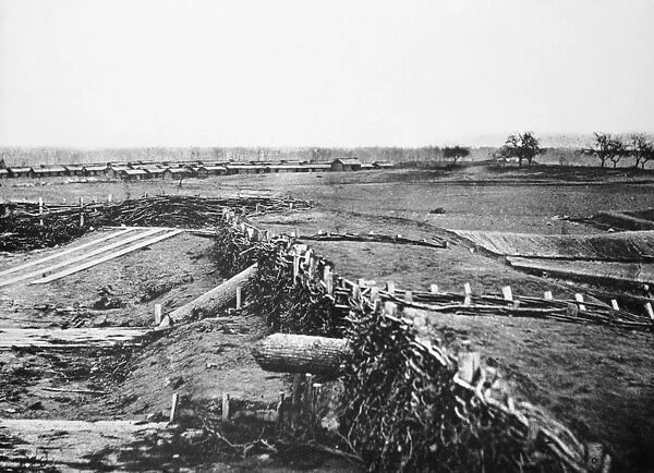 CIVIL WAR: QUAKER GUNS. Logs fashioned into decoy artillery, or so-called Quaker Guns, a successful ruse set up by Confederate forces at Centreville, Virginia. Photographed by George Barnard and James Gibson, March 1862