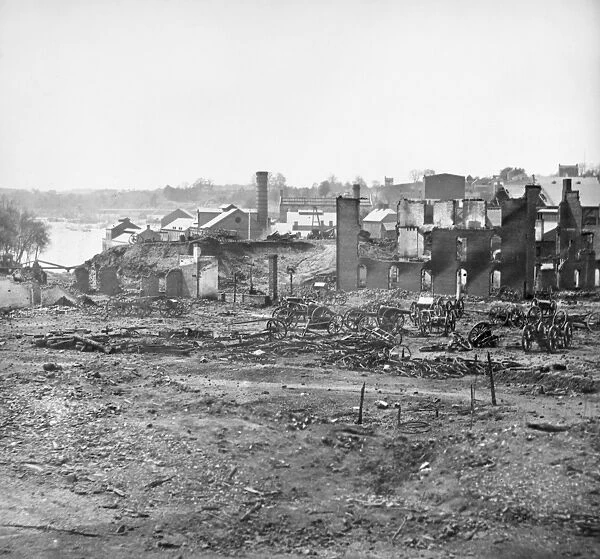 CIVIL WAR: RICHMOND, 1865. Guns and ruins near the Tredegar Iron Works at Richmond, Virginia following the American Civil War. Photograph, April 1865