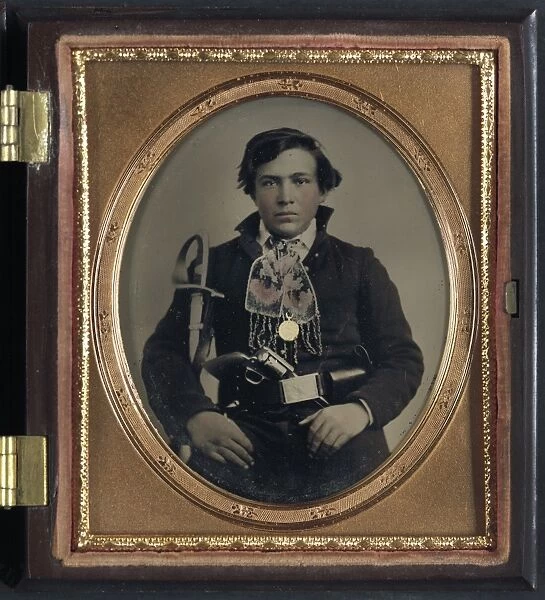 CIVIL WAR: SOLDIER, c1863. Portrait of a Confederate soldier with a cavalry sword and revolver