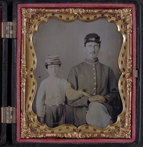 CIVIL WAR: SOLDIER, c1863. Portrait of a Union soldier and a young boy. Ambrotype