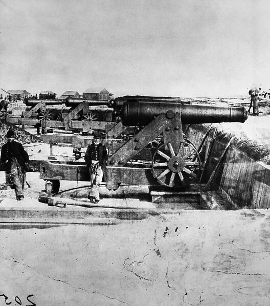 CIVIL WAR: UNION CANNONS. Two Union Army soldiers with an artillery of cannons during the American Civil War. Photograph, c1861