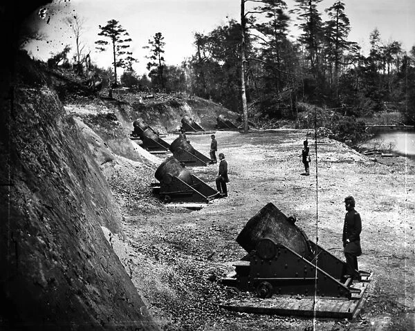 CIVIL WAR: UNION MORTARS. 13-inch seacoast mortars of the Federal Battery Number 4, with officers of the Connecticut Heavy Artillery, near Yorktown, Virginia. Photograph by James F. Gibson, May 1862