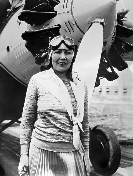 CLAIRE FAHY (1899?-1930). American aviator. Fahy photographed in front of her airplane