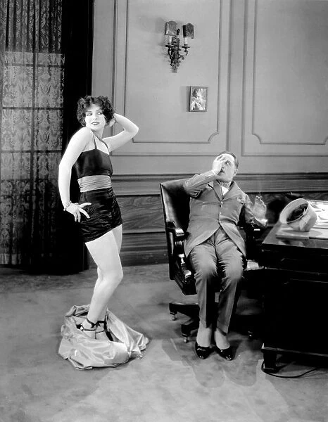 CLARA BOW (1905-1965). American actress. In a scene from Rough House Rosie, 1927