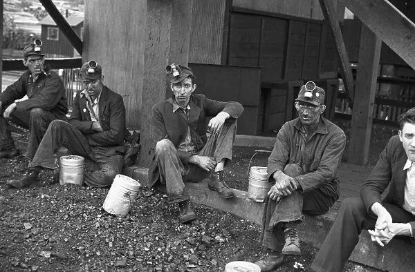 COAL MINERS, 1935. Kentucky coal miners taking a work break, Jenkins, Kentucky