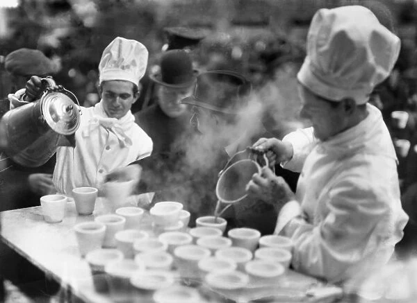 Coffee being poured out at a bread line on 41st Street, New York City, 30 January 1915