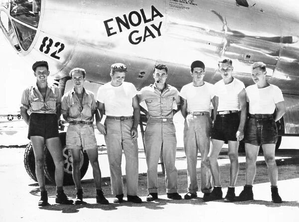 Colonel Paul W. Tibbets (center) and ground crew of the B-29 Enola Gay which dropped the first atomic bomb on Hiroshima, Japan, at the end of World War II, 6 August 1945