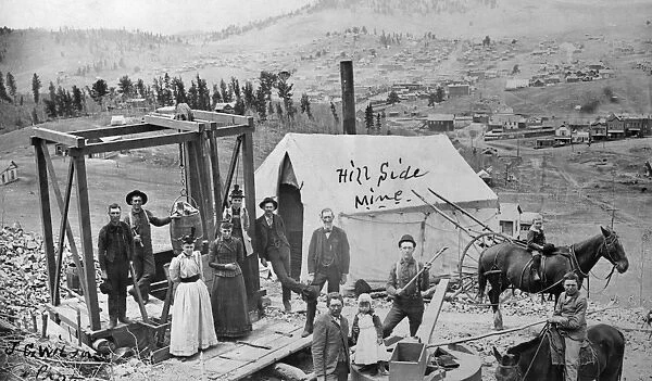 COLORADO: MINERS, c1890. Miners with family members at the Hillside Mine near Cripple Creek