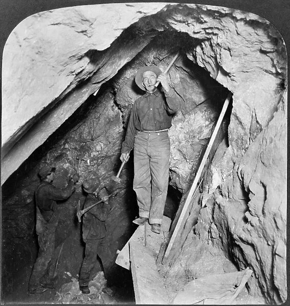 COLORADO: MINING, c1905. Three miners at work in the stope of a gold mine, Eagle River Canyon