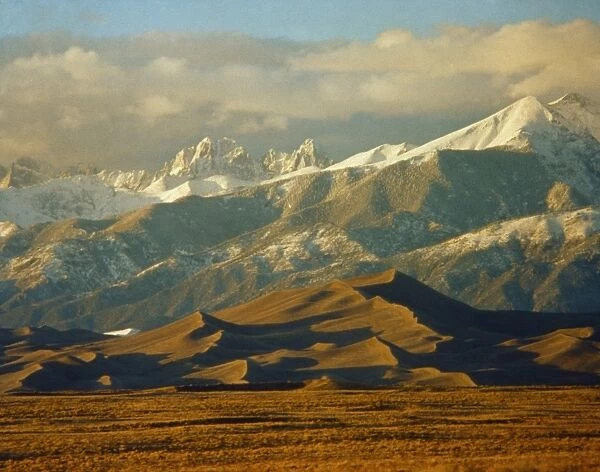 COLORADO: SAND DUNES. Sand dunes and the Crestone Peaks of the Rocky Mountains at the Great Sand Dunes National Park in Colorado. Photograph, c1970