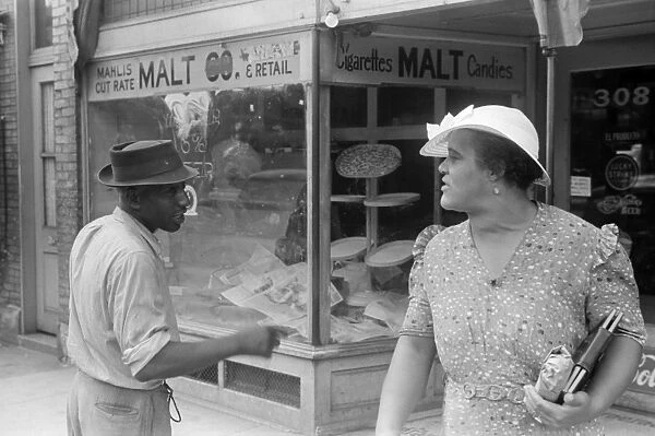 COLUMBUS: STREET, 1938. Conversation on the streets of Columbus, Ohio. Photograph by Ben Shahn