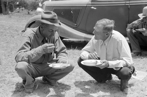 COMMUNITY DINNER, 1940. Men eating dinner at the all-day community sing in Pie Town, New Mexico