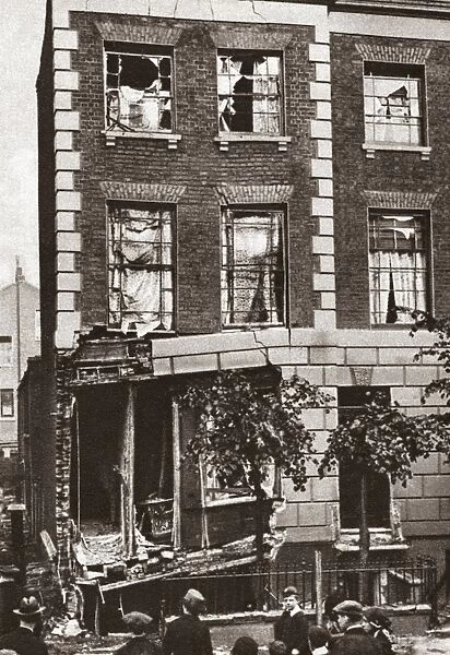 Corner house partially wrecked by bomb dropped from a zeppelin, London, England. Photograph, 1917