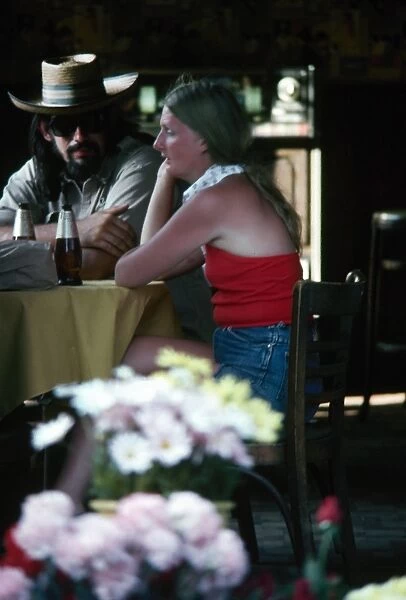 A couple seated in a tavern in the French Quarter of New Orleans, Louisiana. Photographed c1974
