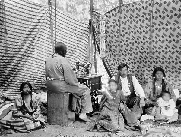 CROW FAMILY, c1906. A Crow family inside their tipi. Photograph by T. A. Morris, c1906