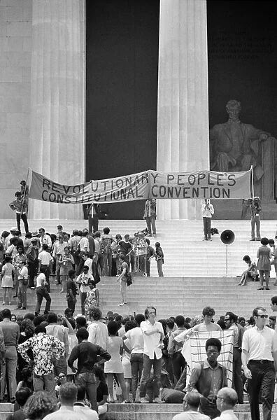 Crowds gathered on the steps of the Lincoln Memorial in Washington, D. C. during a Black Panther convention, with some party members holding a banner calling for a Revolutionary Peoples Constitutional Convention, 19 June 1970. Photographed by Warren K. Leffler or Thomas J. O Halloran