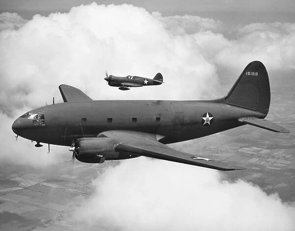A Curtis Commando C-46 transport aircraft accompanied by a Curtis P-40F Warhawk fighter plane, 1942, during World War II
