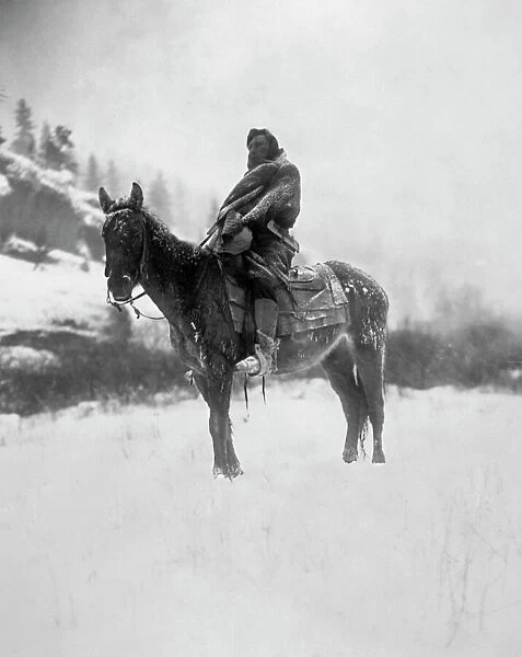 CURTIS: SCOUT, 1908. The scout in winter. Photographed by Edward S. Curtis, 1908