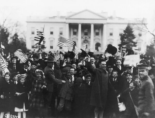 D. C. : ARMISTICE, 1918. A crowd celebrating the victory and armistice at the end of World War I