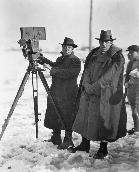 D. W. GRIFFITH (1875-1948). American film producer and director. Griffith, right, and his cameraman G. W. Billy Bitzer filming Way Down East on location, 1920