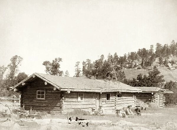 DAKOTA: LOG CABIN, c1887. Log cabin in the Dakota Territory. Photograph, c1890