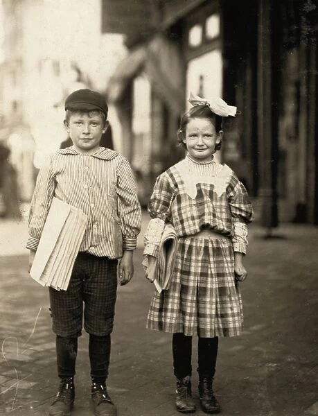 DELAWARE: NEWSBOYS, 1910. A young boy and girl selling papers at Wilmington, Delaware