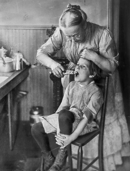 DENTISTRY, 1920s. American home dentistry in the 1920s