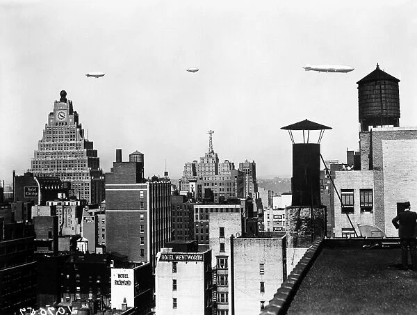 DIRIGIBLES, NEW YORK CITY. American dirigibles flying above New York City, early 20th century photograph