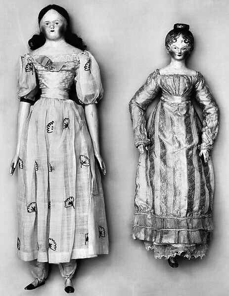 Dolls with (left) wax head, wooden hands and feet, and embroidered muslin dress with full skirt and puffy sleeves; and (right) painted wooden head, hands and feet, and long sleeved dress. American, 1790s