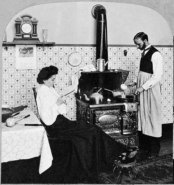 DOMESTIC COUPLE, c1903. Mrs. and Mrs. Henpeck get supper. In a reversal of traditional roles