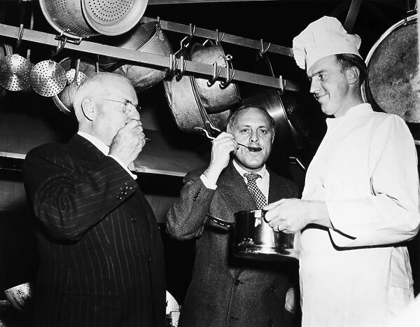 DUNCAN HINES (1880-1959). American food critic and author. Hines (left) and Ted Shane sampling food prepared by Francis Chevalier (right) at the 2nd annual chefs tournament in Fredericksburg, Virginia, 30 March 1948