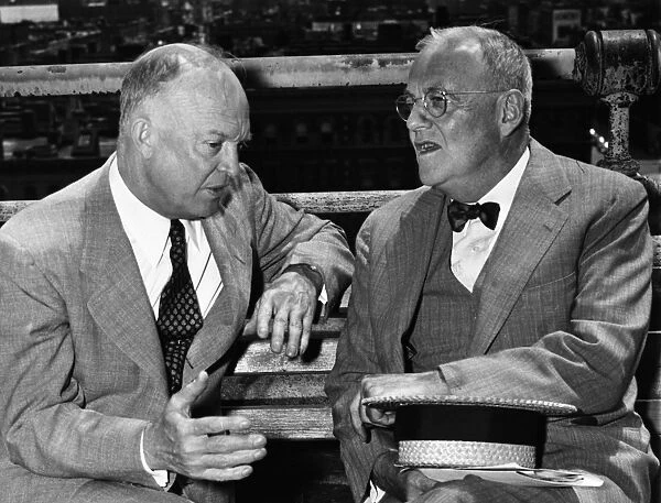 DWIGHT D. EISENHOWER (1890-1969). 34th President of the United States. Photographed during the 1952 presidential campaign, conferring with his foreign policy advisor (and future Secretary of State) John Foster Dulles (right) on a park bench in Morningside Heights, New York City, 11 June 1952