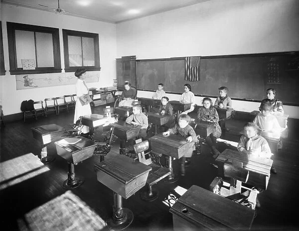 EAST SIDE FREE SCHOOL, c1910. Disabled children in a classroom at the Crippled