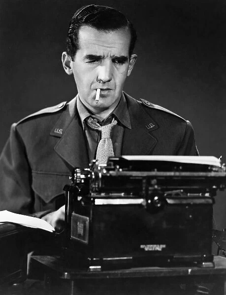 EDWARD MURROW (1908-1965). Edward Roscoe Murrow, American broadcast journalist and news commentator. Photographed at his typewriter, mid 20th century