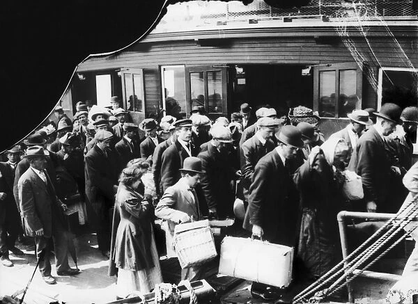 ELLIS ISLAND, 1914. European immigrants to the United States arriving at Ellis Island by ferry