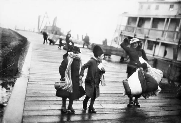 ELLIS ISLAND: IMMIGRANTS. A family of Belgian refugees arriving at Ellis Island, New York City