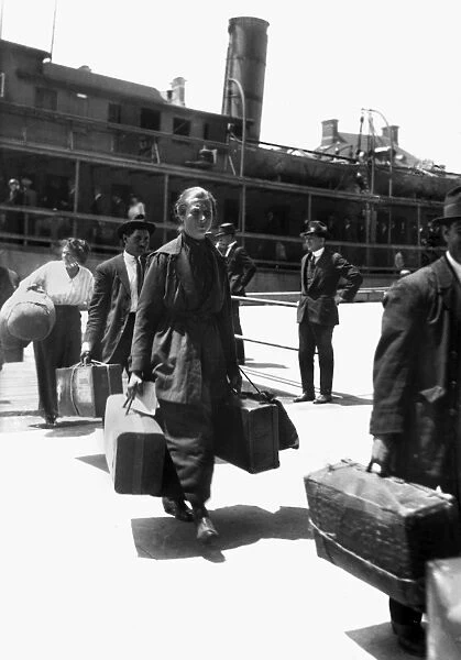 ELLIS ISLAND: IMMIGRANTS. Immigrants arriving at Ellis Island, New York City. Photograph