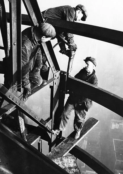 EMPIRE STATE BUILDING, 1931. Steelworkers on girders of the Empire State Building, New York City
