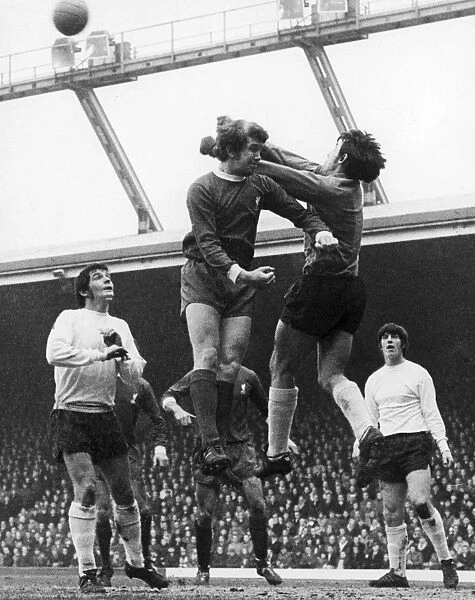 ENGLAND: SOCCER GAME, 1970. Gordan Banks, the goalkeeper for Stoke City FC punches the ball away from Chris Lawler of Liverpool during a game, 26 December 1970