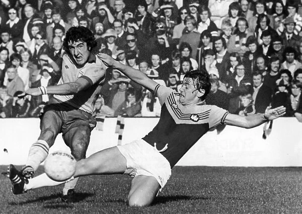 ENGLAND: SOCCER MATCH, 1976. Keith Coleman (right) of West Ham United tackles Brian Talbot of Ipswich Town during a soccer match, 16 October 1976