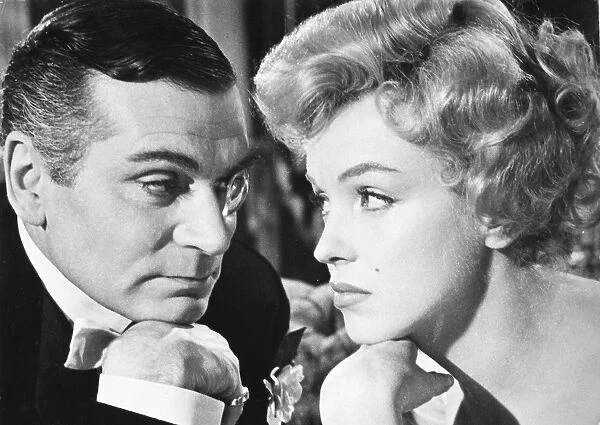 English actor. Laurence Olivier as the Prince and Marilyn Monroe as the Showgirl of the title